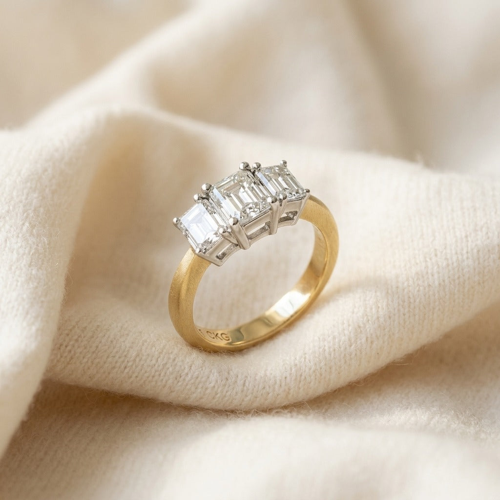 3 Stone Emerald Cut Band in 14K Two-Tone Gold - flat lay