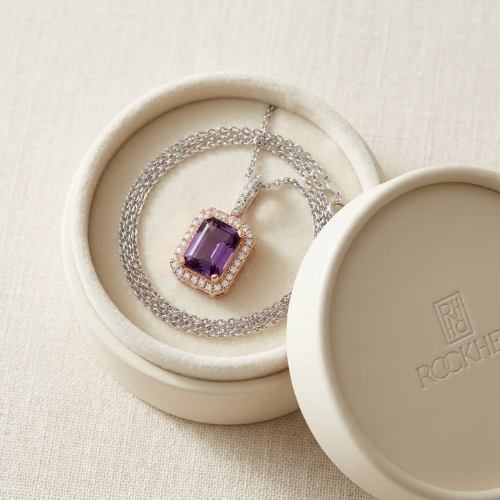 Amethyst And Diamond Emerald-cut Halo Pendant In 14k Two Tone Gold (8x6mm Center), in navy velvet jewelry box