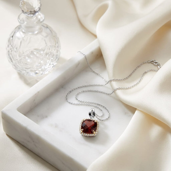 Garnet Pendant in 14K White Gold, on marble vanity tray with silk