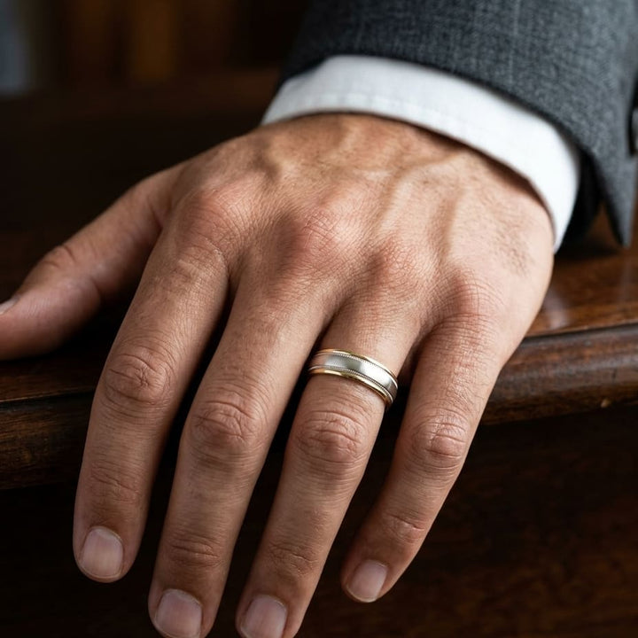 6mm High Polish Milgrain Round Edge Carved Wedding Band in 14K Two-Tone Gold, worn on hand, masculine close-up