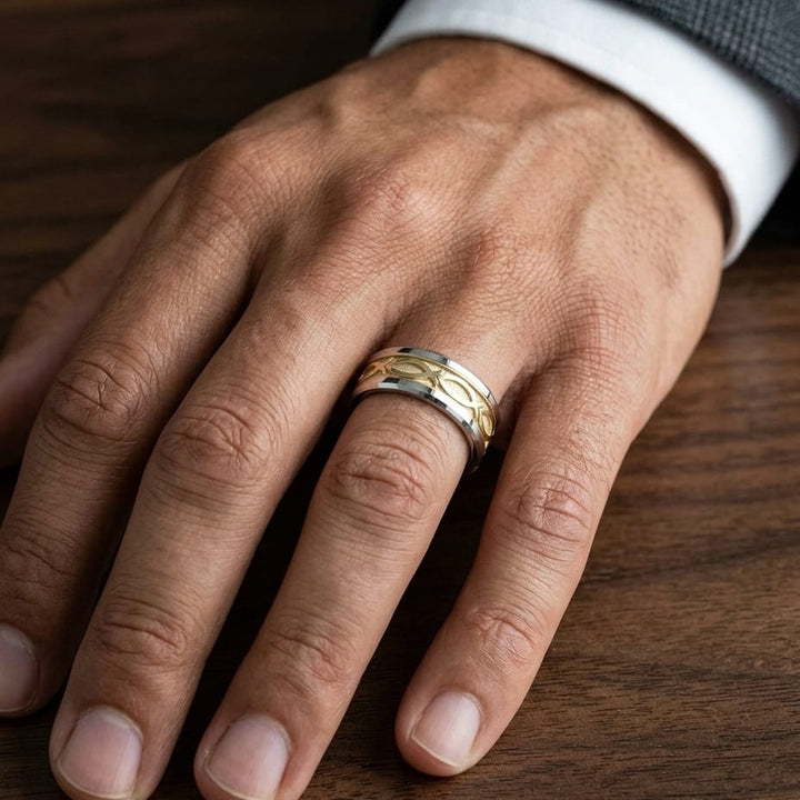 8mm Drop Bevel Ichthys Carved Wedding Band in 14K Two-Tone Gold, worn on hand, masculine close-up