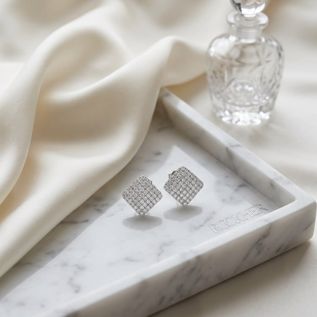 Natural Diamond Round Brilliant Stud Earrings in 14K White Gold, 0.7 ct. t.w., on marble vanity tray with silk