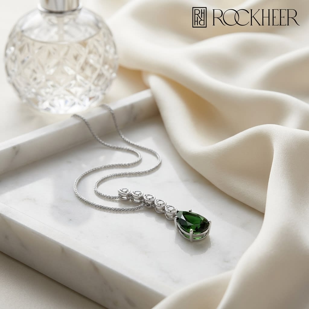 Green Tourmaline Pendant in 14K White Gold, on marble vanity tray with silk
