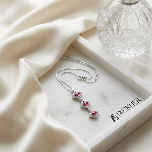 Pink Tourmaline Halo Pendant in 14K White Gold, on marble vanity tray with silk