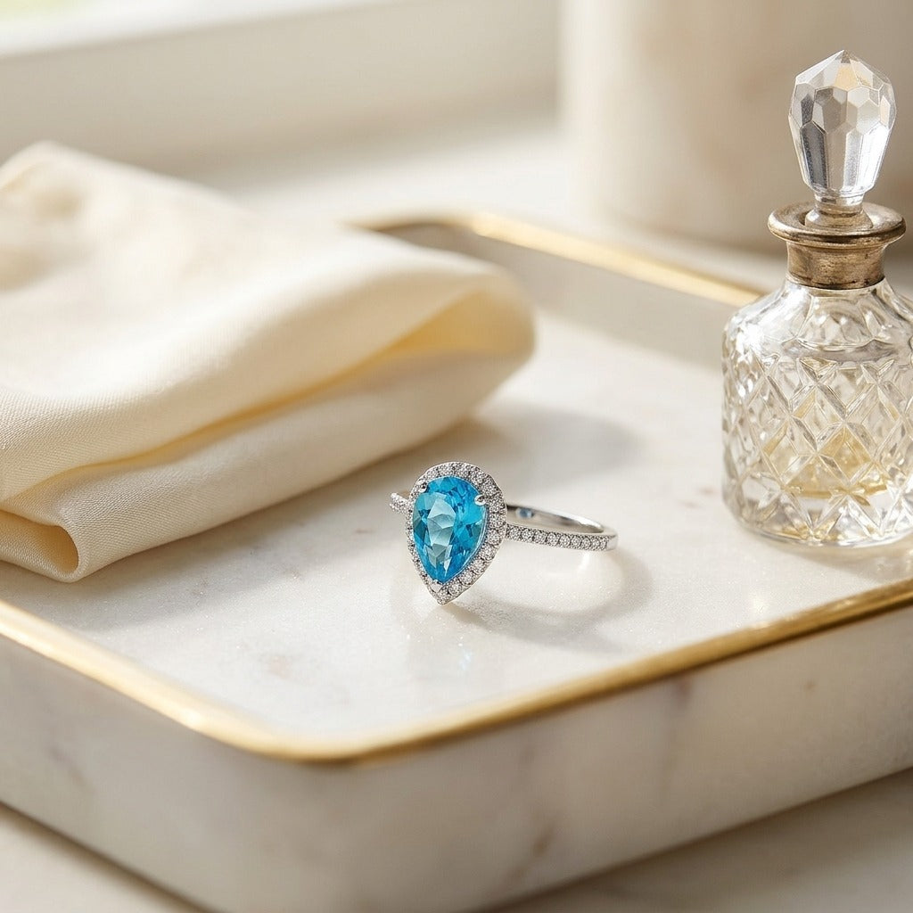 Blue Topaz & Diamond Pear Shape Halo Ring in 14K White Gold - editorial