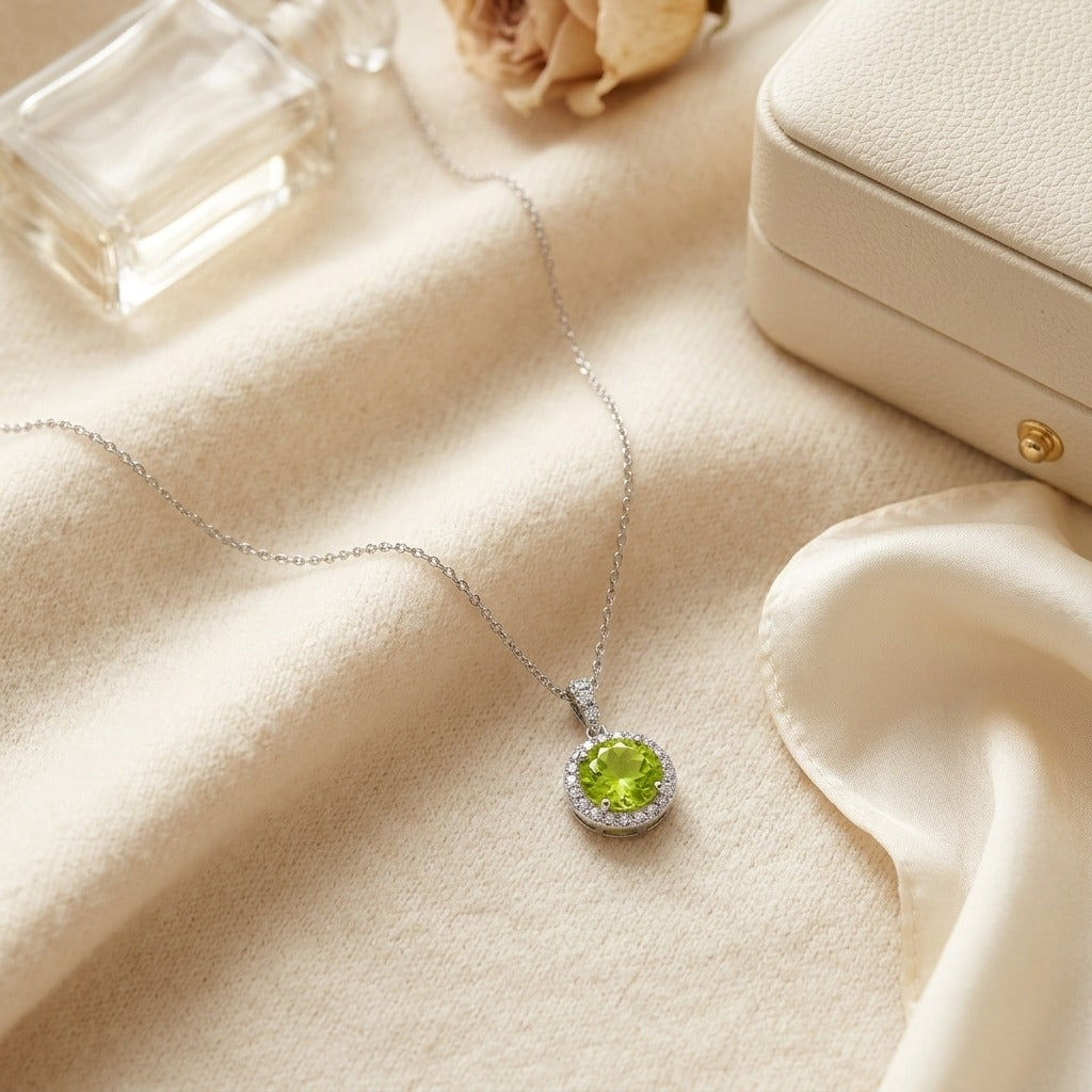 Peridot & Diamond Circle Halo Pendant with 18 Inch Baby Curb Chain in 14K White Gold - flat lay