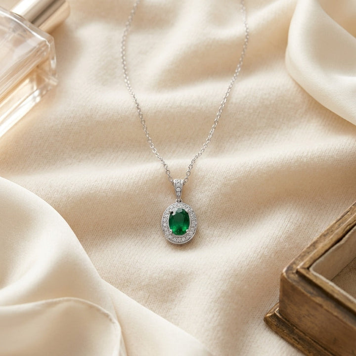 Emerald & Diamond Oval Halo Pendant 16 in Rolo Chain in 14K White Gold - flat lay