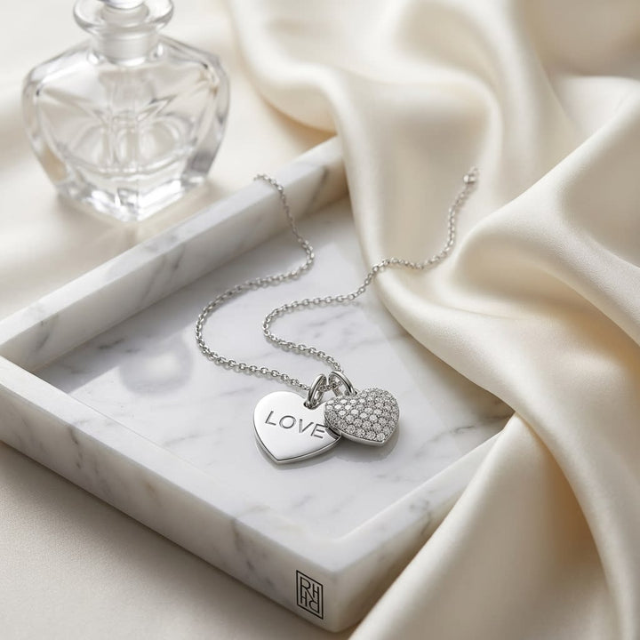 Natural Diamond Heart Shape Pendant in 14K White Gold, on marble vanity tray with silk