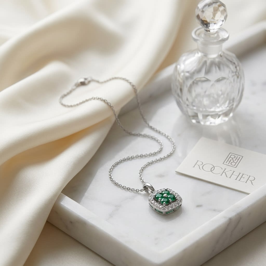 Emerald Pendant in 14K White Gold, on marble vanity tray with silk