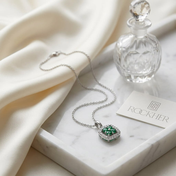 Emerald Pendant in 14K White Gold, on marble vanity tray with silk
