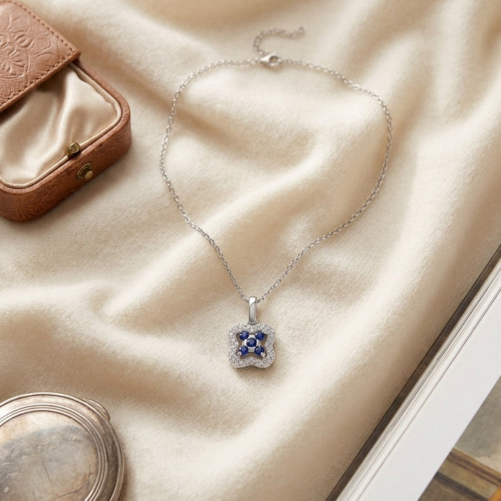 Sapphire & Diamond Floral Petal Pendant in 14K White Gold - flat lay