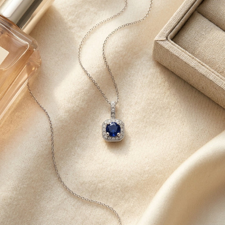 Sapphire & Diamond Halo Pendant 17 in Curb Chain in 14K White Gold - flat lay