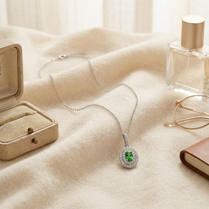 Tsavorite & Diamond Double Oval Halo Pendant 17 in Curb Chain in 14K White Gold - flat lay