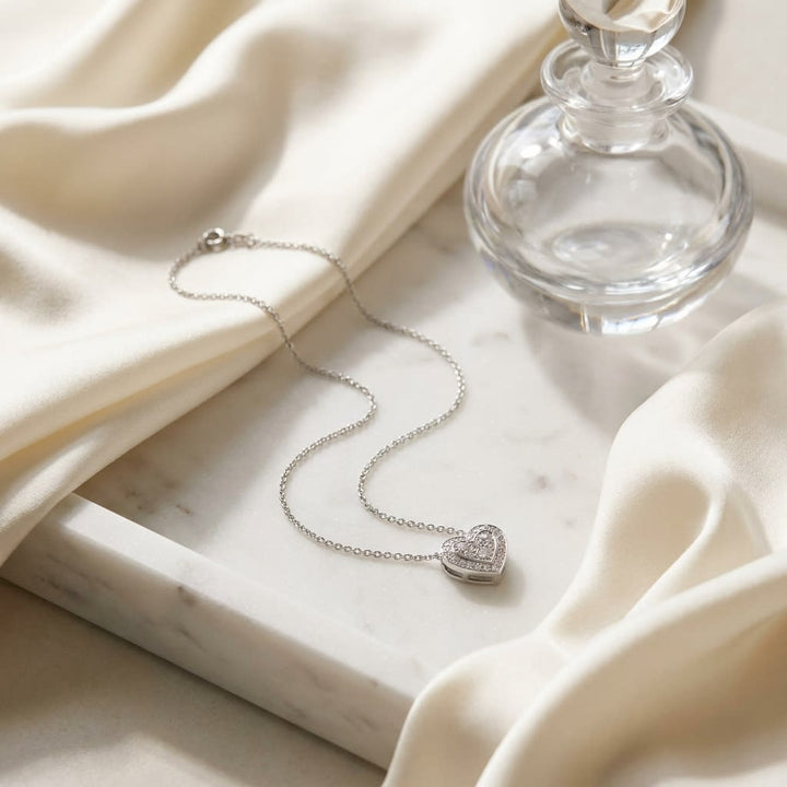 Heart Diamond Pendant in 14K White Gold, 0.39ct, on marble vanity tray with silk