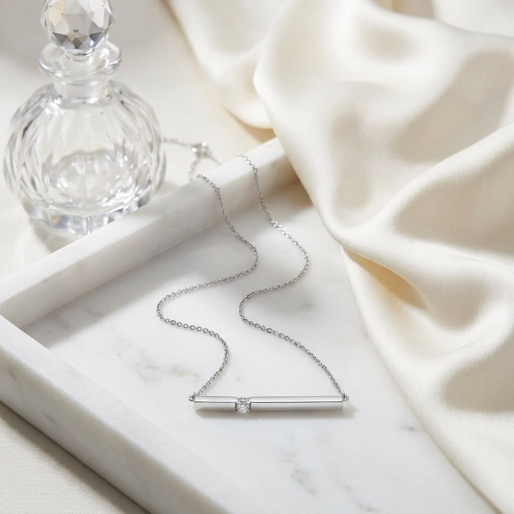Diamond Bar Necklace in 14K White Gold 0.10ctw, on marble vanity tray with silk