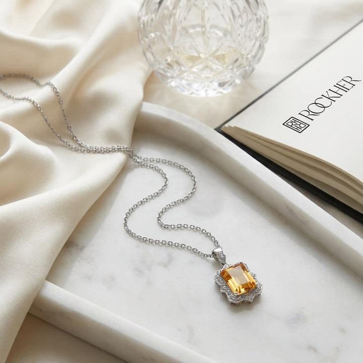 Citrine Emerald Cut Pendant in 14K White Gold, on marble vanity tray with silk