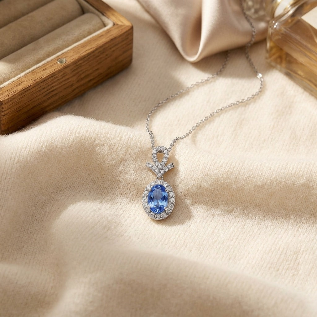 Sapphire Oval & Pave Diamond Halo Pendant in 14K White Gold - flat lay