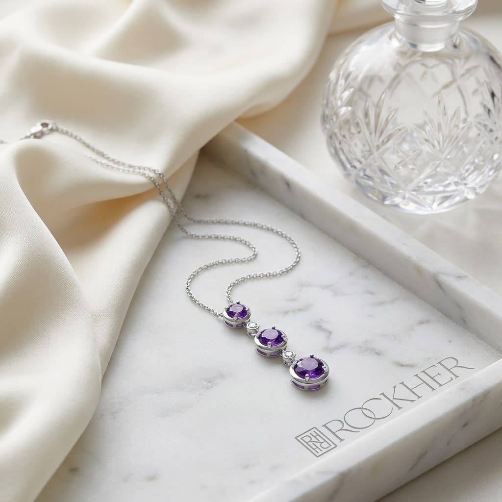 Amethyst Pendant in 14K White Gold, on marble vanity tray with silk