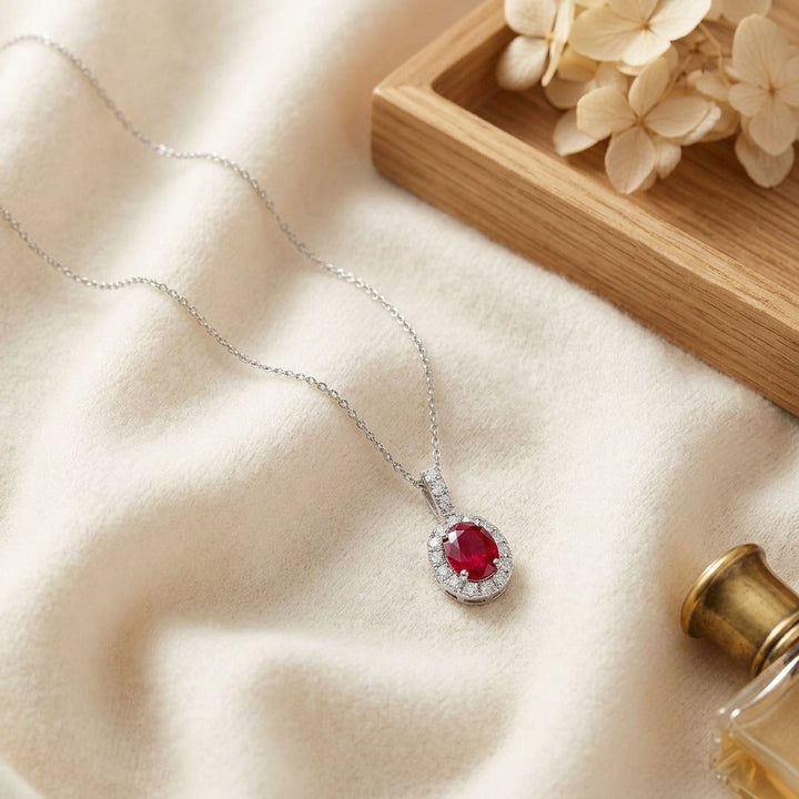 Ruby Oval & Diamond Halo Pendant in 14K White Gold - flat lay