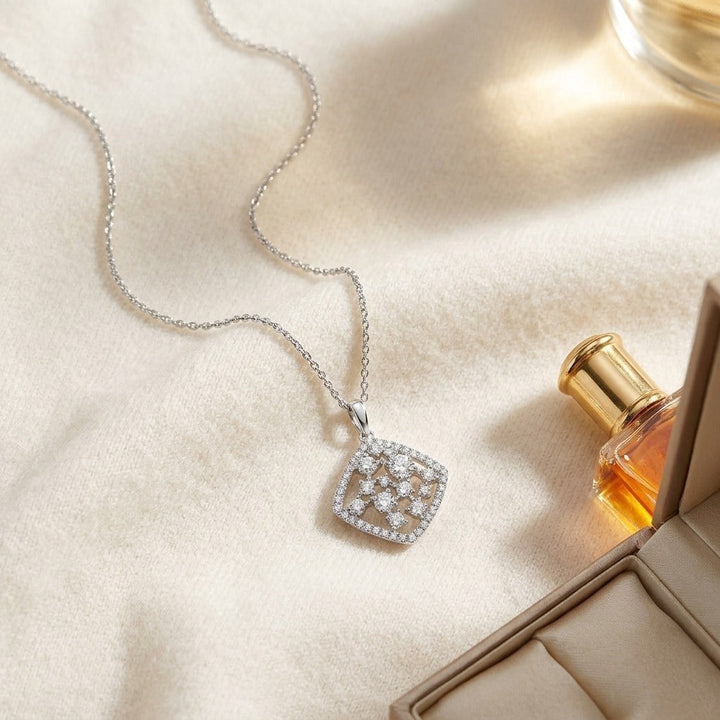 Floating Diamond Round Pendant with Diamond Shaped Border in 14K White Gold - flat lay