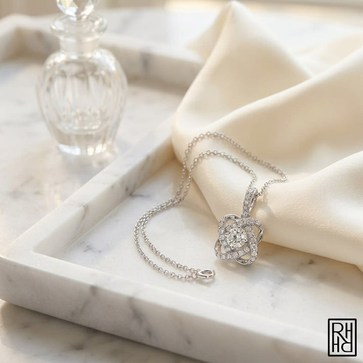 Round Diamond Cross Pavé Pendant in 14K White Gold, on marble vanity tray with silk