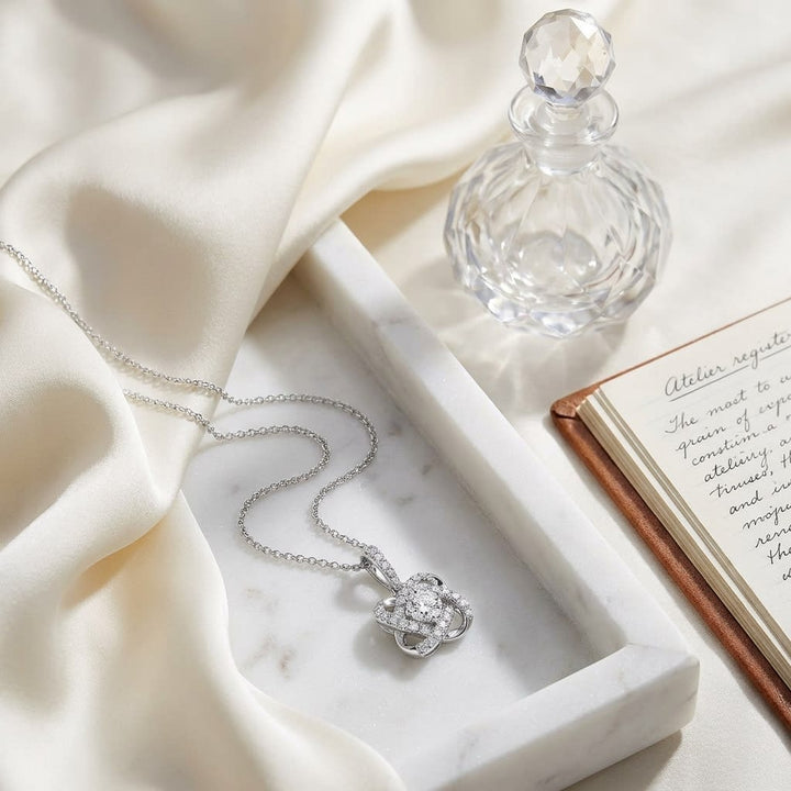 Natural Diamond Round Brilliant Pendant in 14K White Gold, on marble vanity tray with silk