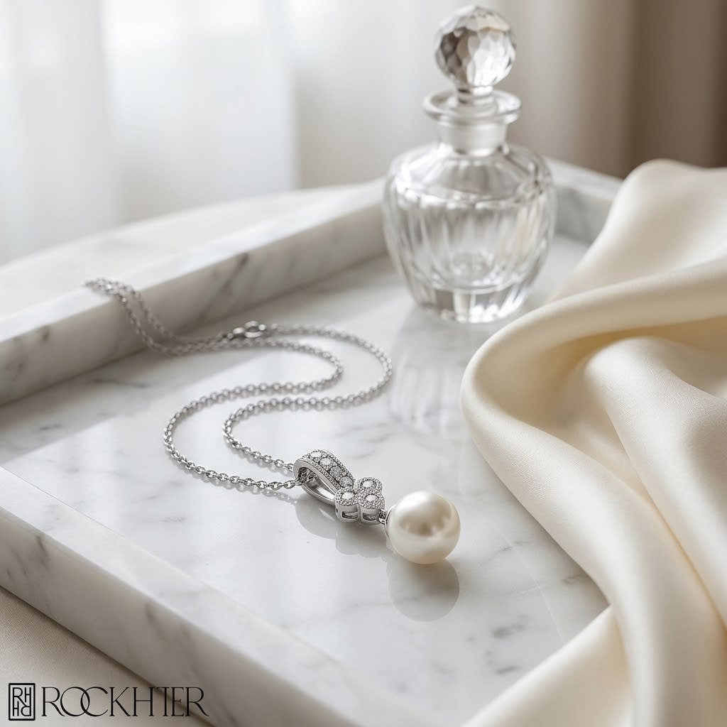 Cultured Pearl Pear Shape Pendant in 14K White Gold, on marble vanity tray with silk