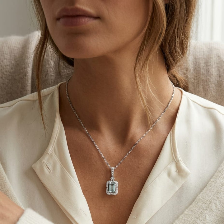 Aquamarine Emerald Cut Halo Pendant in 14k White Gold 0.15ctw, worn close-up portrait