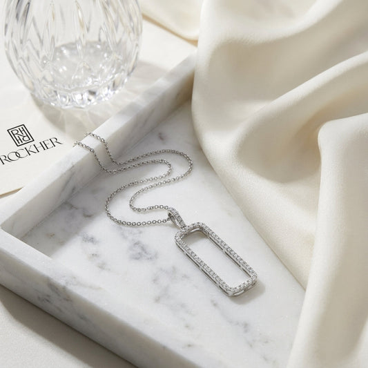 Diamond Open Rectangle Necklace In 14k White Gold 0.42ctw, 18 Inch Rolo Chain, on marble vanity tray with silk