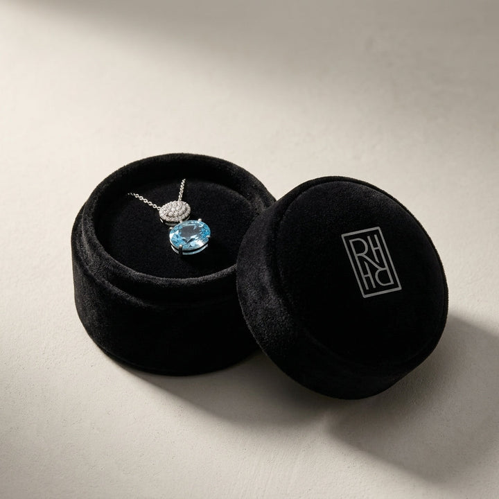 Blue Topaz Oval & Diamond 1/16ctw Pendant Set with Chain in 14K White Gold - presentation