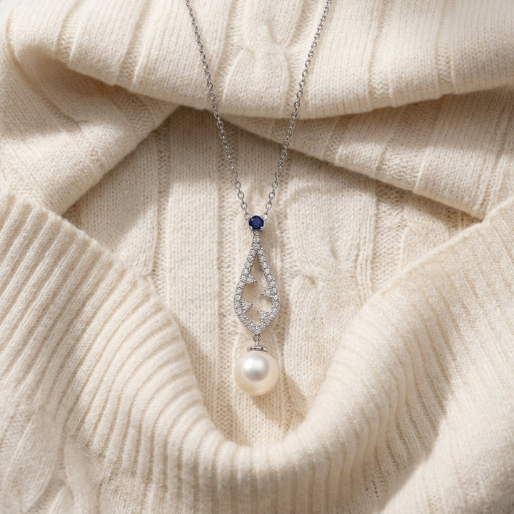 Akoya Pearl Sapphire & Diamond Drop Pendant 1/5ctw 18-in Adj Cable Ch in 14K White Gold - flat lay