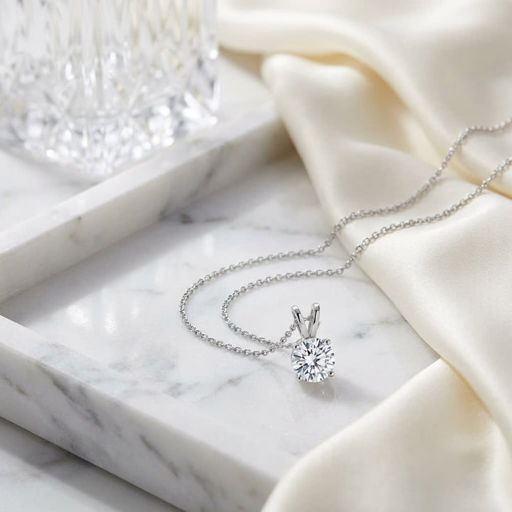 Natural Diamond Round Brilliant Solitaire Pendant in 14K White Gold, 8 ct. t.w., on marble vanity tray with silk