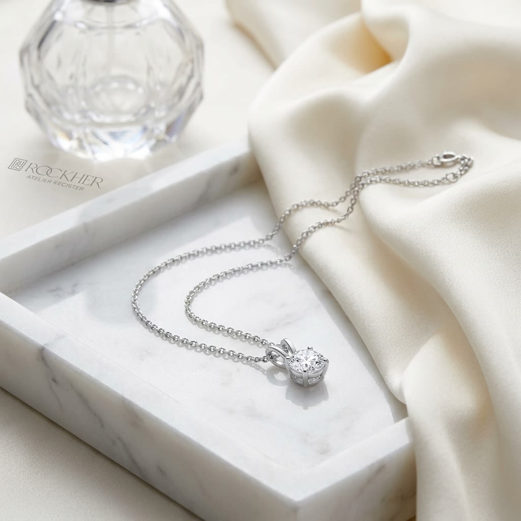Natural Diamond Round Brilliant Solitaire Pendant in 14K White Gold, 2 ct. t.w., on marble vanity tray with silk