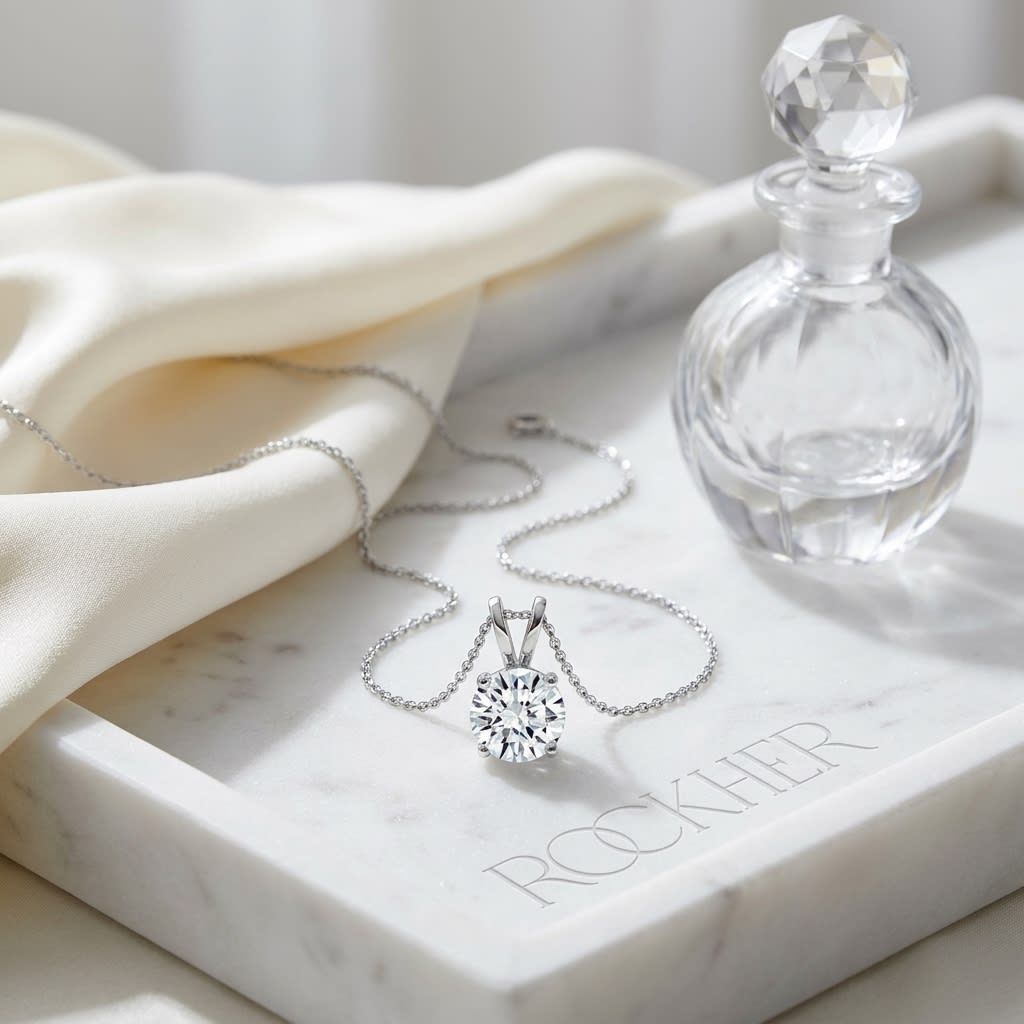 Natural Diamond Round Brilliant Solitaire Pendant in 14K White Gold, 4 ct. t.w., on marble vanity tray with silk