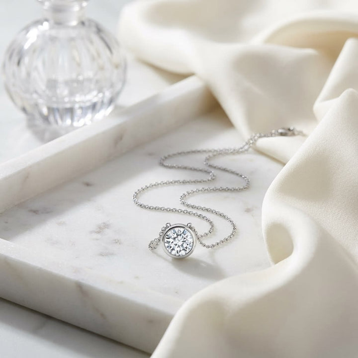 Natural Diamond Round Brilliant Solitaire Pendant in 14K White Gold, 4 ct. t.w., on marble vanity tray with silk