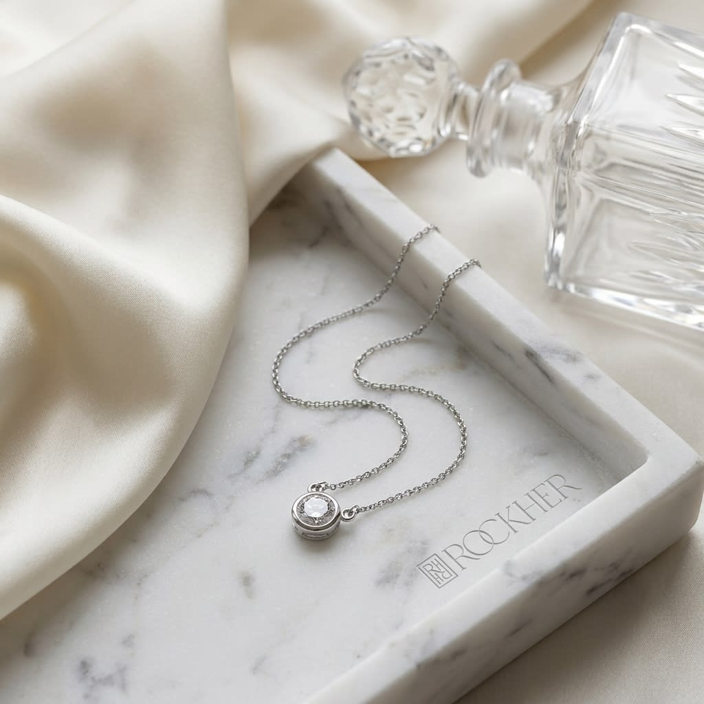 Natural Diamond Round Brilliant Solitaire Pendant in 14K White Gold, 4 ct. t.w., on marble vanity tray with silk
