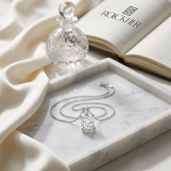 Natural Diamond Princess Cut Solitaire Pendant in 14K White Gold, 2 ct. t.w., on marble vanity tray with silk