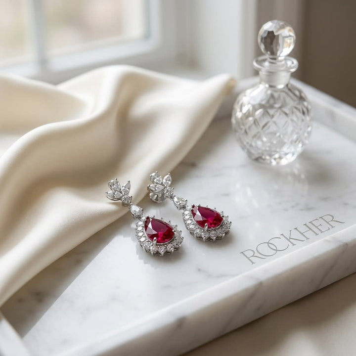 Rubellite And Diamond Teardrop Dangle Earrings in 14K White Gold, on marble vanity tray with silk