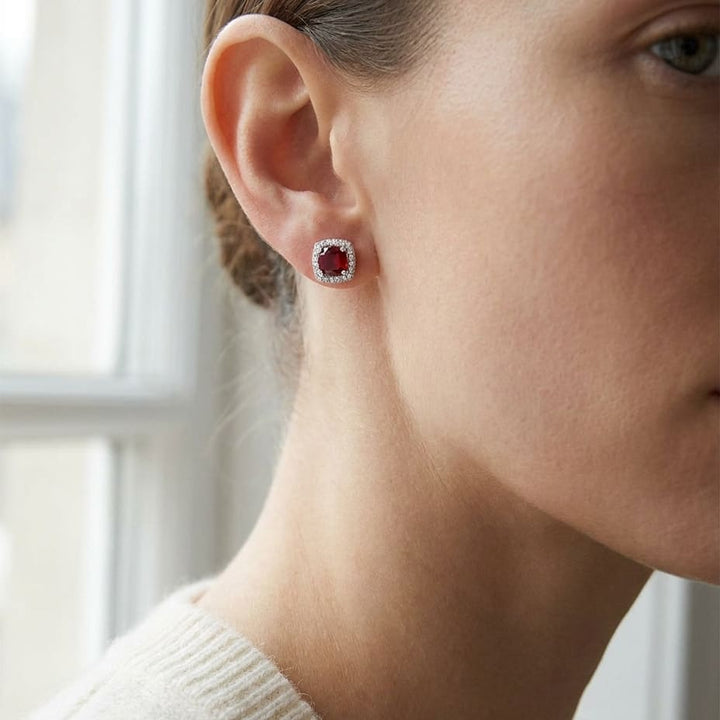 Garnet And Diamond Cushion Halo Earrings In 14k White Gold, worn close-up portrait