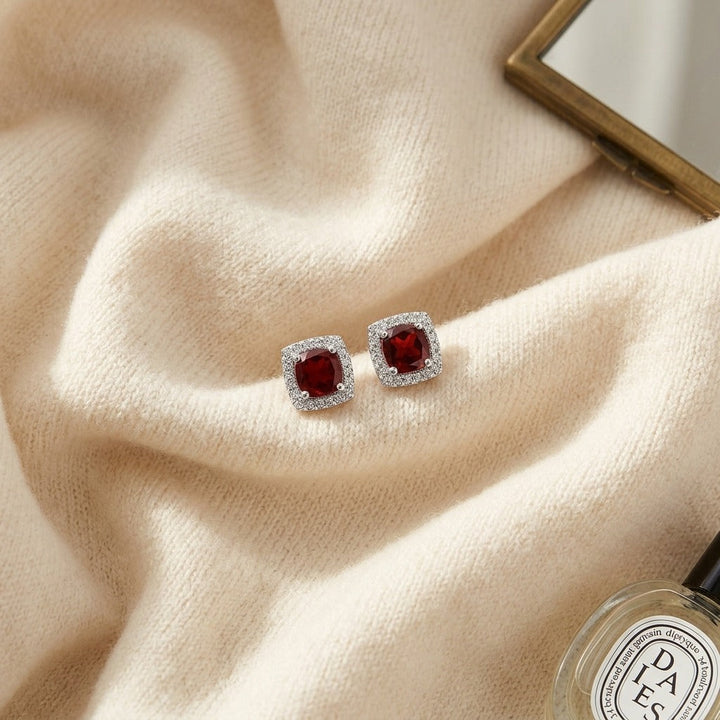 Garnet & Diamond Cushion Halo Earrings in 14K White Gold - flat lay