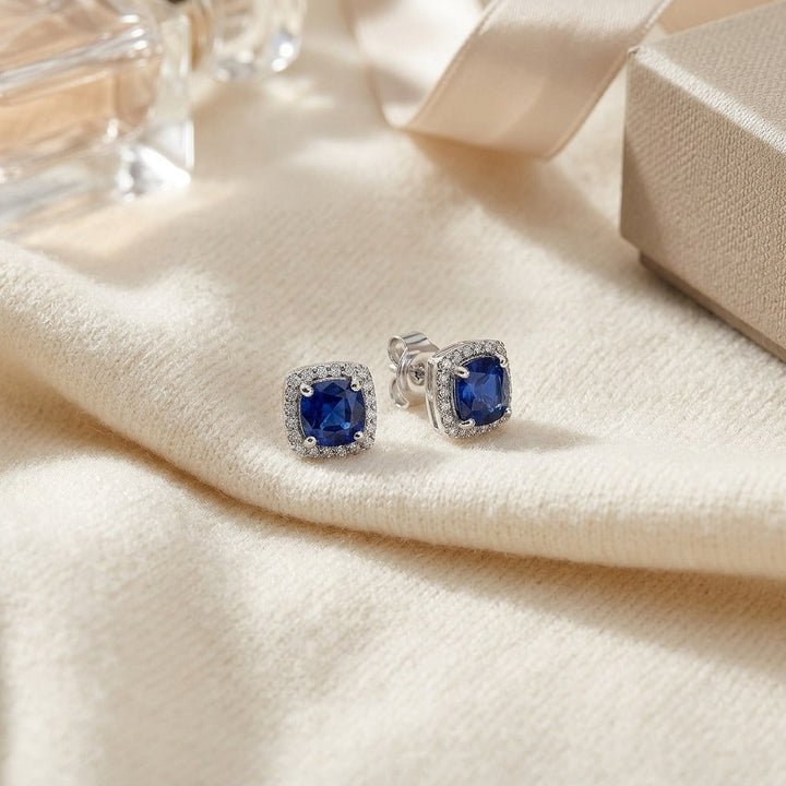 Sapphire & Diamond Cushion Halo Earrings in 14K White Gold - flat lay