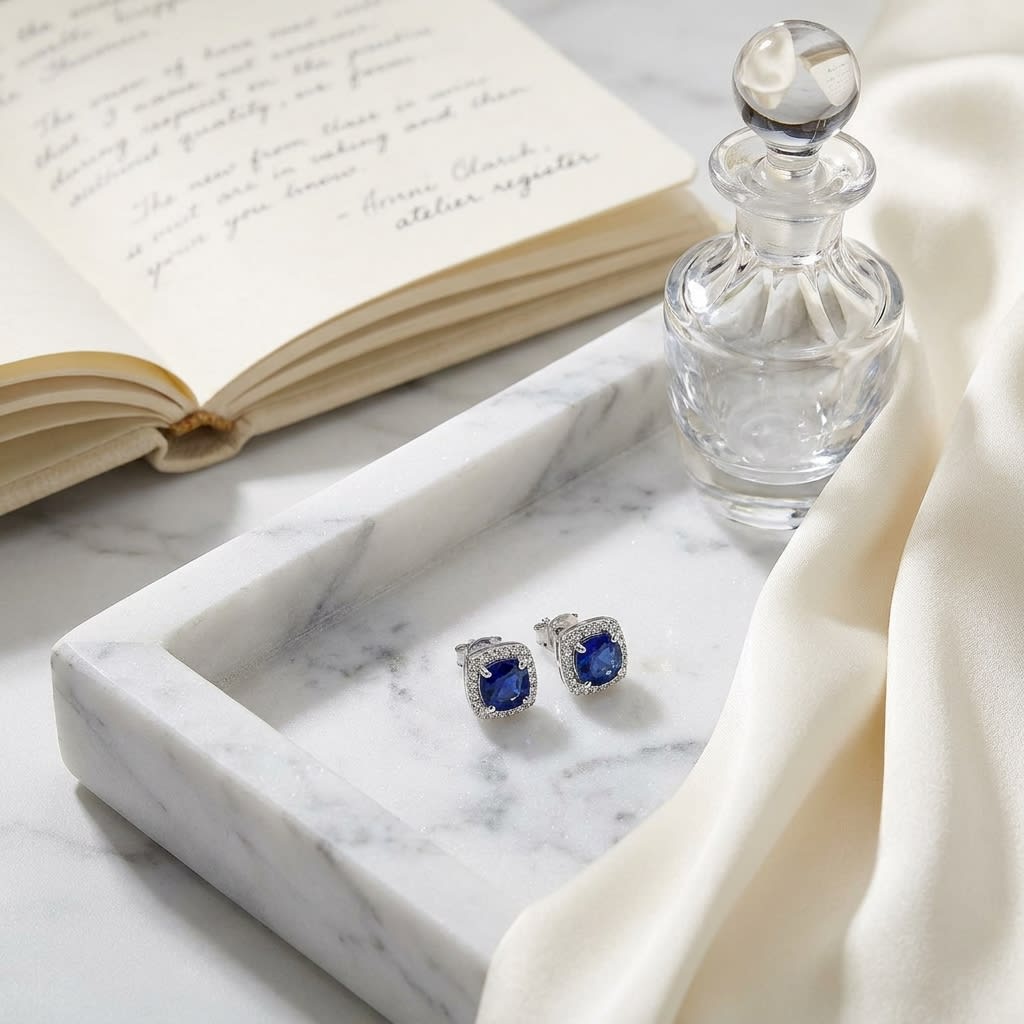 Sapphire Cushion Stud Earrings in 14K White Gold, on marble vanity tray with silk