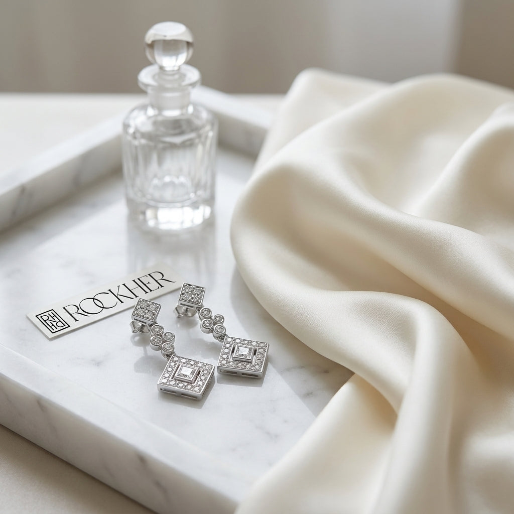 Diamond Princess/round Dangle Earrings 14K White Gold, on marble vanity tray with silk