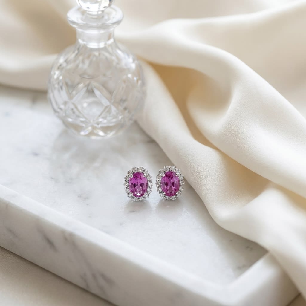 Pink Sapphire Round Brilliant Stud Earrings in 14K White Gold, on marble vanity tray with silk