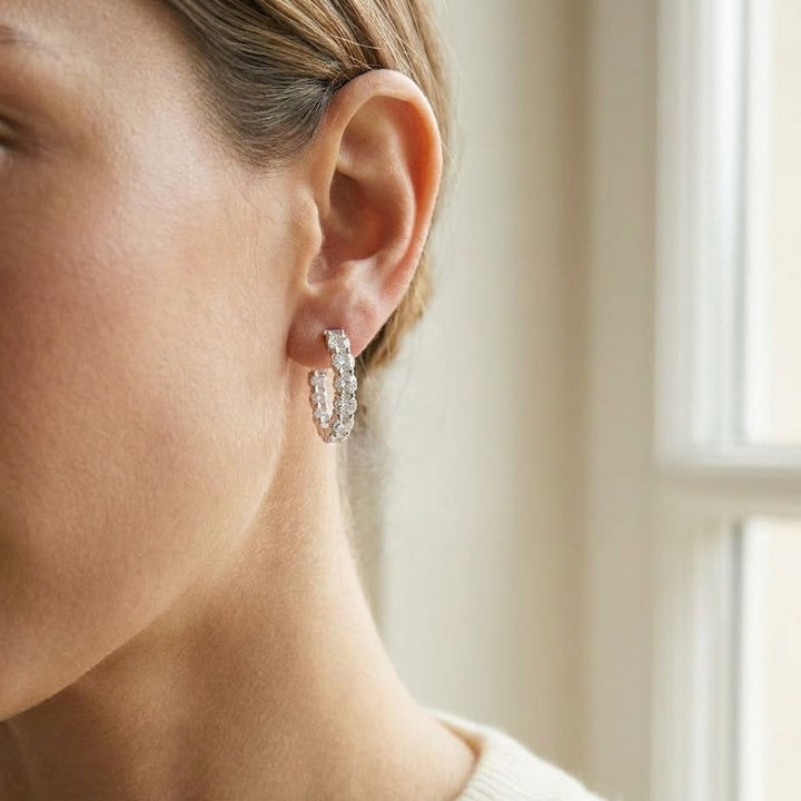 Diamond Hinged Oval Hoop Earrings in 14k White Gold 0.70ctw, worn close-up portrait