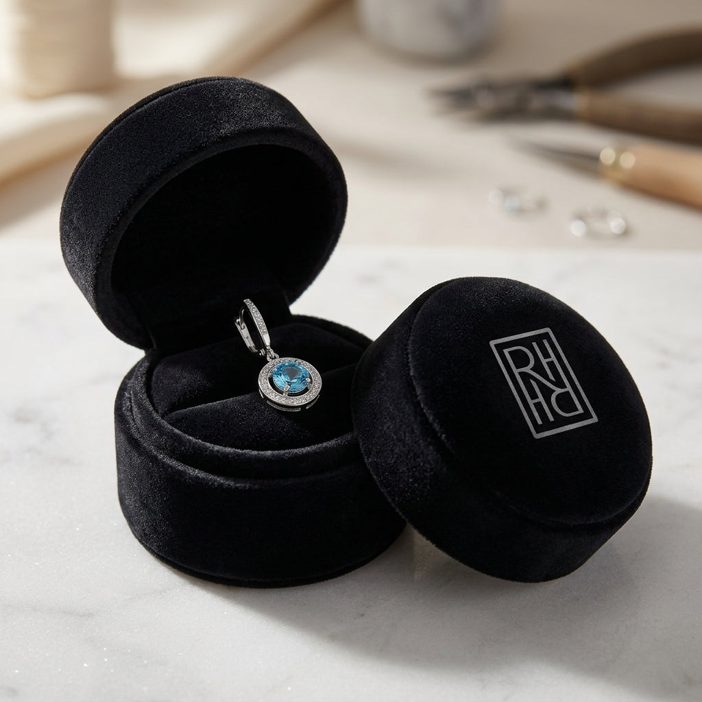 Blue Topaz And Diamond Swirl Dangling Earrings in 14K White Gold, in navy velvet jewelry box