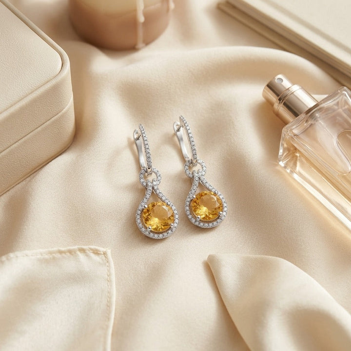Citrine & Diamond Round Doorknocker Earrings in 14K White Gold - flat lay