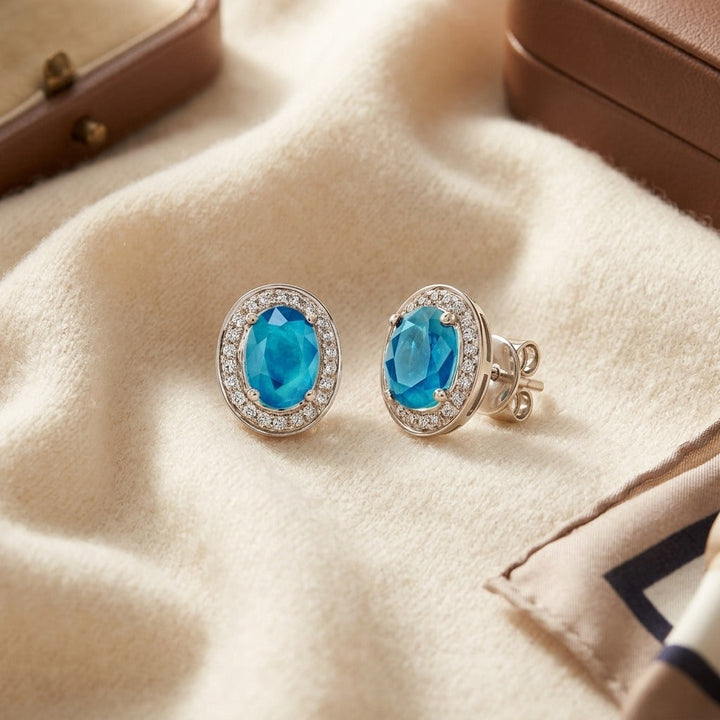 Aquamarine & Diamond Oval Halo Stud Earrings in 14K White Gold - flat lay