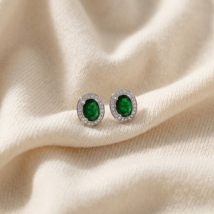 Emerald Oval & Diamond Earrings in 14K White Gold - flat lay