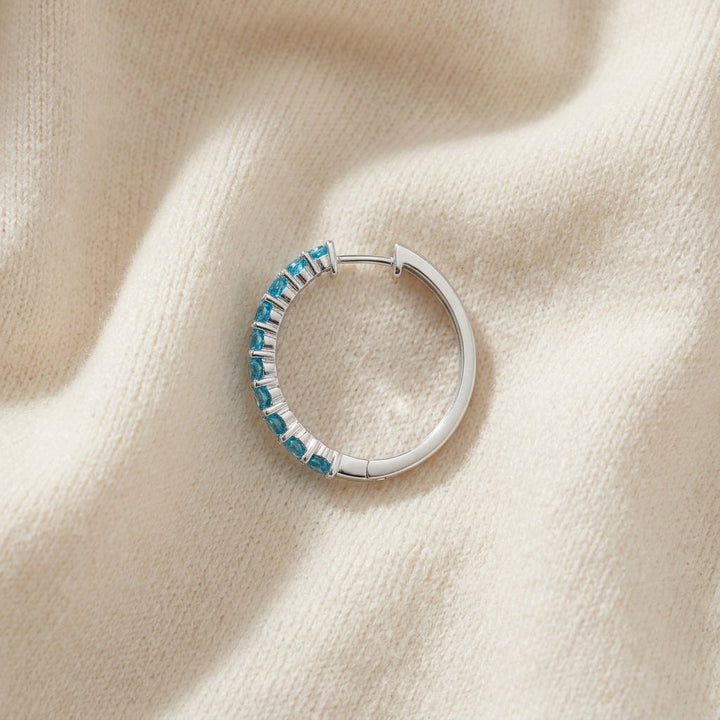 14K Gold 2.40ctw Blue Topaz Hoop Earrings in 14K White Gold - flat lay